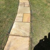 Curved natural stone garden pathway landscaping Woking