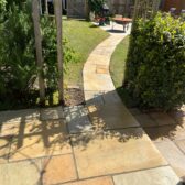 Curved sandstone garden path patio pergola lawn Woking