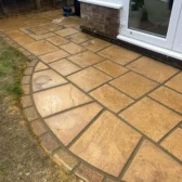 Curved sandstone patio installation Woking